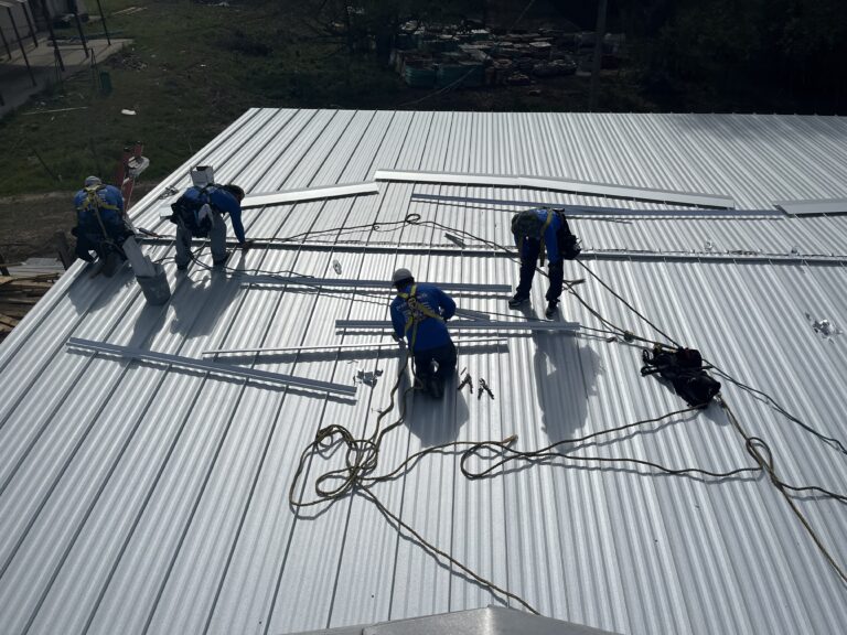 metal roof aerial view workers